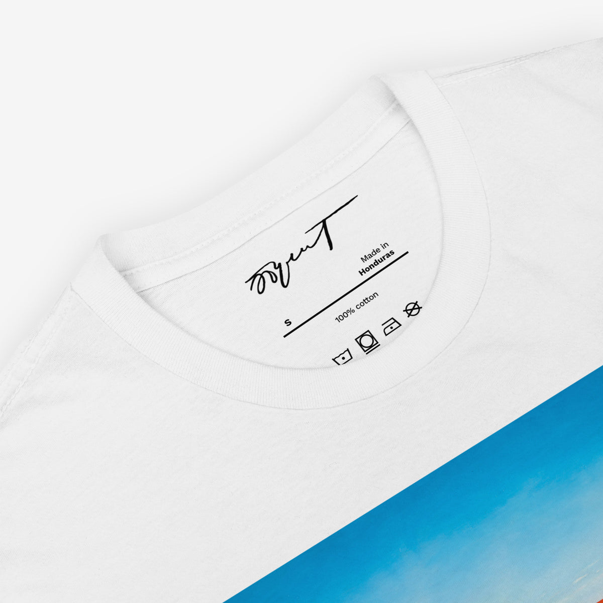 White unisex T-shitrt featuring large print of Erik Bulatov Red Horizon painting  showing people walking toward a massive red and gold Soviet ribbon on a beach. Necktag featuring Erik Bulatov's signature